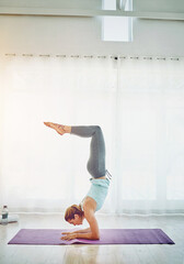 Yoga, woman and handstand in studio for fitness on floor with balance, flexibility and arm...