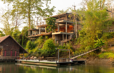 Fototapeta premium Houses on the River Kwai in Thailand