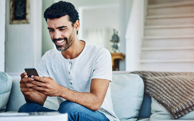 Smile, phone and man typing on sofa for texting, communication or online notification in living room. Contact, connection and person with smartphone for social media, networking or web app in home