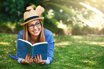 Nature, thinking and girl with book for reading, learning and knowledge with smile outdoor. Park,...