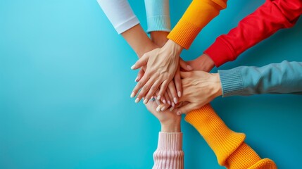A group of people are holding hands in a circle