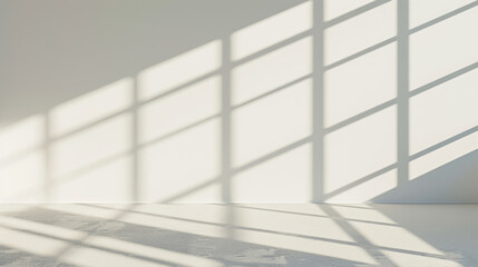 Serene shadows cast by geometric patterns on a minimalistic white wall.