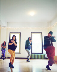 Fototapeta premium Dancer group, fitness and hip hop for breakdance with teacher to practice for performance. People, team and dancing class to learn steps and formation together in rehearsal for competition training