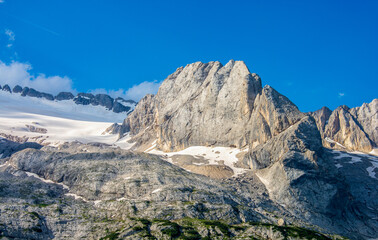 the last snow at the end of Spring and beginning of Summer in the Dolomite mountains on the Marmolada glacier