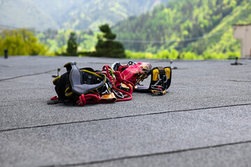 climbing equipment on the roof of an 8-story apartment building. preparation for high-altitude work