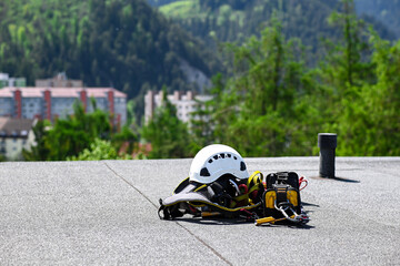 climbing equipment on the roof of an 8-story apartment building. preparation for high-altitude work