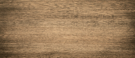 Close-up of a warm brown wooden grain pattern showing detailed texture.