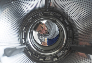 Repairman fixing a washing machine