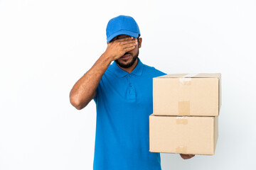 Delivery Ecuadorian man isolated on white background covering eyes by hands. Do not want to see...