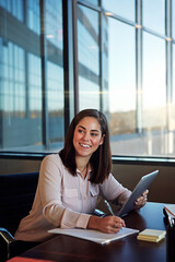 Happy woman, accountant and writing with tablet for budget planning, finance or review at office. Female person, employee or financial advisor with smile on technology for research, report or audit