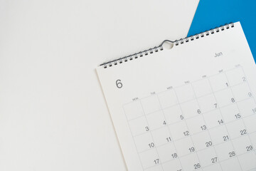 close up of calendar on the white and blue table background, planning for business meeting or travel planning concept