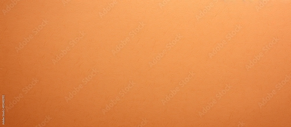 Aufkleber colored textured cardboard with an apricot paper texture is depicted in the copy space image