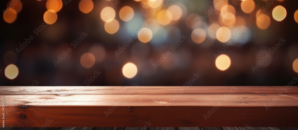 Poster An empty wooden table with a blurred abstract background providing ample copy space for text marketing promotions