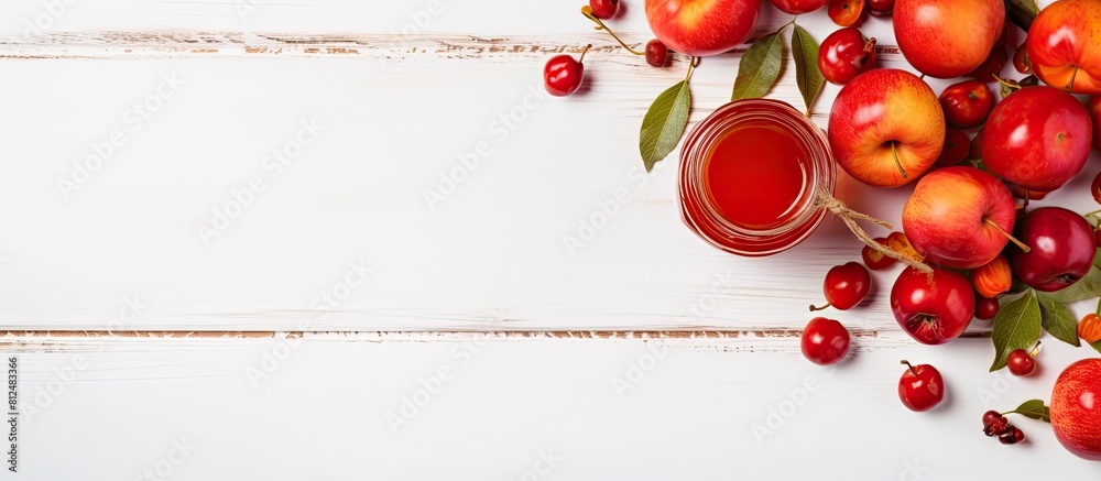 Poster An autumn harvest of Paradise apples is showcased in a top view displayed on a white wooden table along with a jar of sweet Paradise apple jam The composition allows for copy space in the image