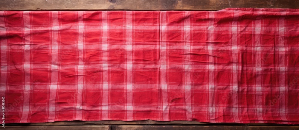Leinwandbilder an old wooden table is shown from above with a vibrant red tablecloth leaving an empty space for add