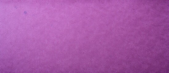 The rough textured purple and violet paper background is lightly spotted with a blank area for copy...