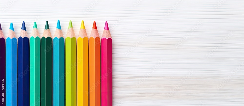 Poster colorful drawing pencils arranged on a white wooden surface creating an educational concept the dive