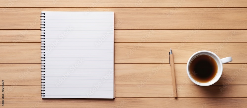 Leinwandbilder top view of a wooden office desk table with a blank notebook page a pen and a cup of coffee the imag
