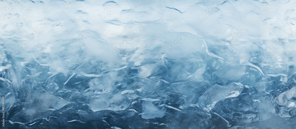 Poster close up of a frozen river with cracked ice covered in white snow and revealing the deep blue water 