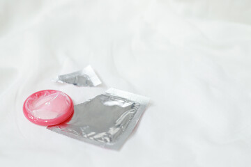 condom safe sex concept on the bed Prevent infection and Contraceptives control the birth rate or...
