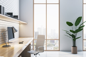 Side view of modern home office interior with workplace, window with city view and brick wall,...