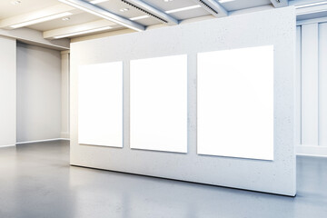 Three blank posters on a gallery wall, clean modern interior with concrete and white elements, concept of an art display. 3D Rendering