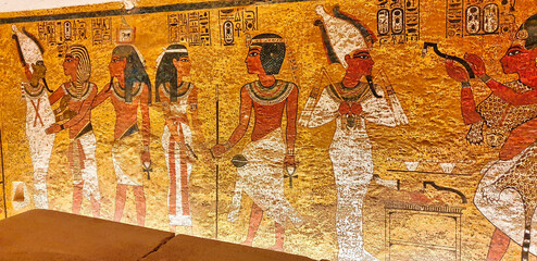 Painted wall relief depicting Tutankhamun and his soul,Ka,embracing Osiris and Goddess Nut inside...