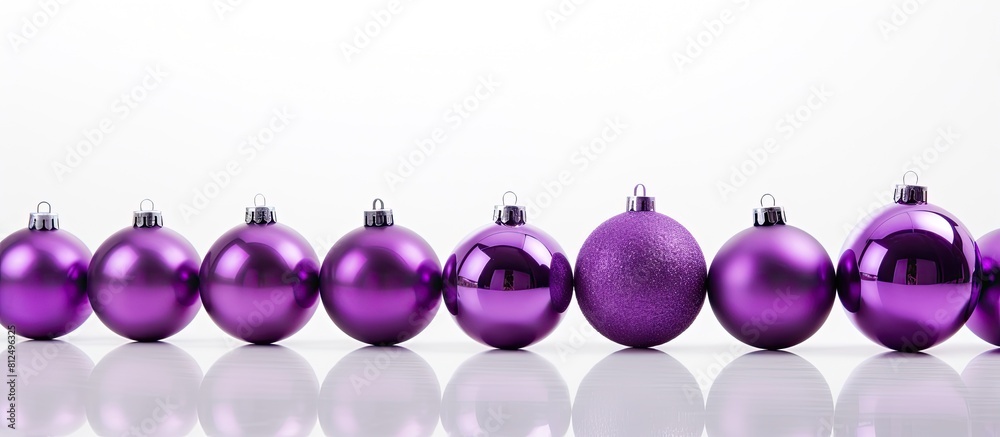 Poster A copy space image featuring a background of violet Christmas balls creating a festive and isolated photo on a white background