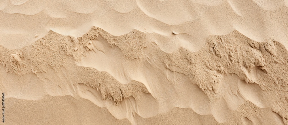Poster a background image featuring a close up shot of a textured sand floor ideal for use as a copy space 