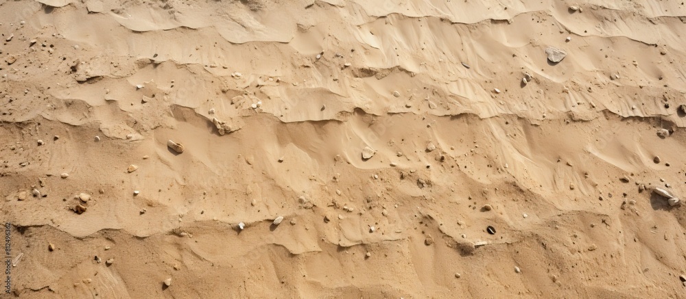 Poster a background image featuring a close up shot of a textured sand floor ideal for use as a copy space 