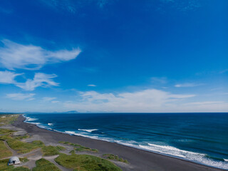 Beautiful nature Landscape of Khalaktyrsky beach with black volcanic sand coast of North Pacific Ocean Kamchatka Russia, aerial top view