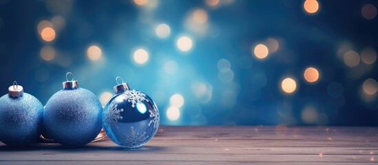 Christmas ornaments in blue color set against a nighttime backdrop creating a festive ambiance during the holiday season copy space image
