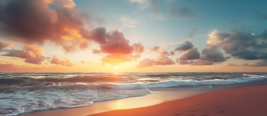 Fototapeta premium The sandy beach under a beautiful sunset sky provides a perfect setting with ample copy space for your design work