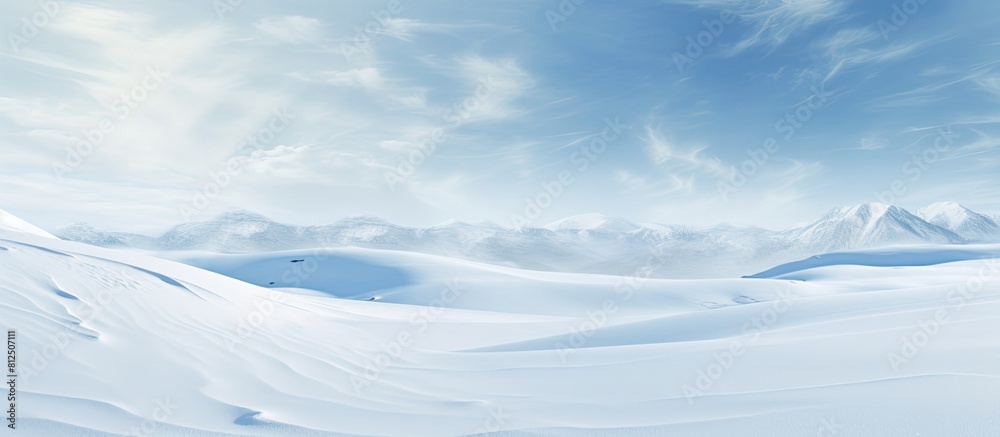 Poster Winter landscape with snowy ground and wind sculpted patterns on the snow surface creating a wide panoramic background The natural snow texture adds to the beauty of the copy space image