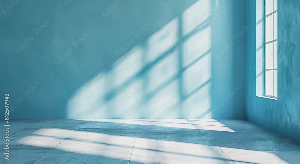 Sticker A minimalist image showing a spacious empty room with blue walls, sunlight casting shadows through a window creating patterns on the floor