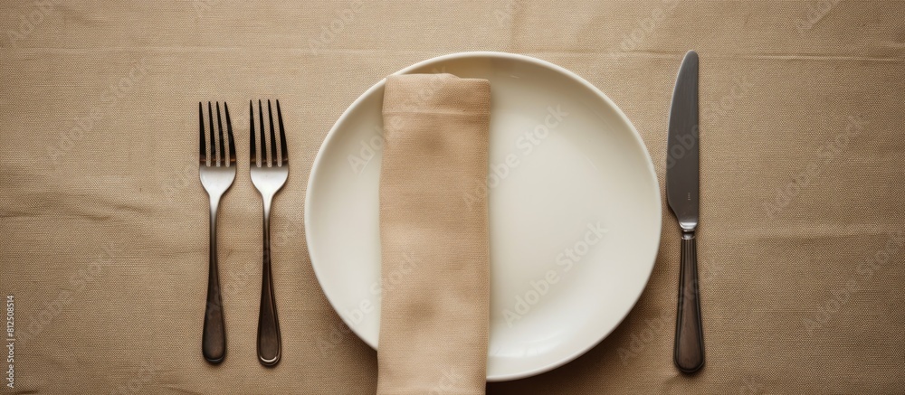 Aufkleber A minimal style table setting for Easter spring with fork knife and napkin The background features a close up top down view with ample copy space