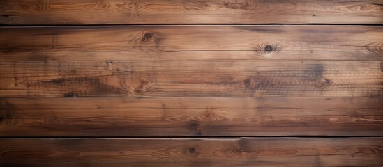 Fototapeta premium A background with a surface texture of brown wood planks in a loft style providing ample copy space