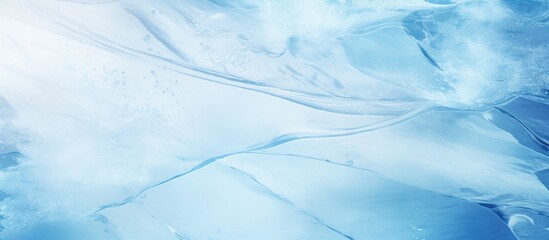 Abstract background of a blue toned ice texture with skate marks perfect for winter outdoor skating providing an appealing copy space image