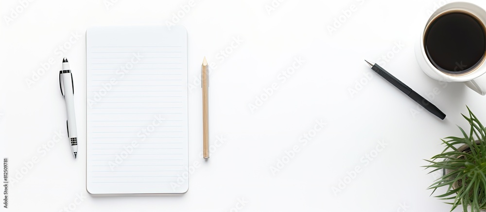 Poster top down view of a well equipped working space showcasing a notepad pen smart phone and cup of coffe