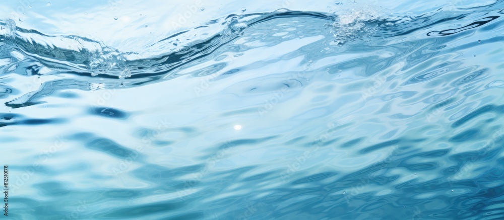 Leinwandbilder Top view of a clear water surface with rippling patterns set against a light blue background creating a visually appealing copy space image