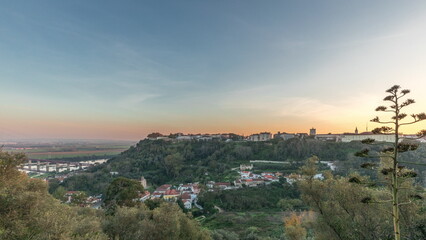 Panorama showing sunset over the Castle of Almourol on hill in Santarem aerial timelapse. Portugal