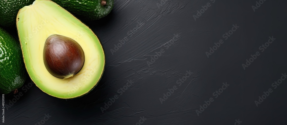 Poster A top view of a whole avocado on a light background with a frame that provides space for text. Creative banner. Copyspace image