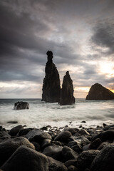 Ribeira da Janela. Volcanic  rock formations standing the Atlantic Ocean at dramatic sunrise,...