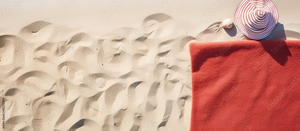 Aufkleber top view of beach accessories and towel on a sandy beach with ample space for text a perfect image t