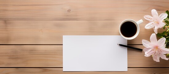 Top view of an office table desk adorned with various supplies such as a white blank note pad a cup a pen a pc a crumpled paper and a flower all placed on a wooden background with ample copy space im