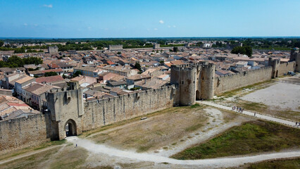 Fortified city of Aigues-Mortes, in Provence in France. Entirely surrounded by an imposing city wall and purple salt pans of incredible beauty, Aigues-Mortes is a jewel, an enchanting medieval village