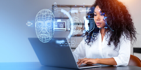 Black businesswoman using laptop, biometric scanning and face id hologram