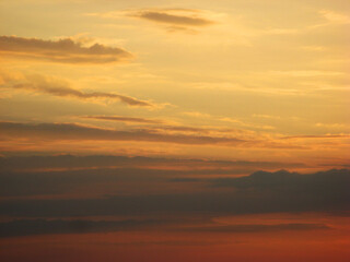 Sunset sky with dark clouds and golden sky and clouds