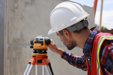  Civil engineer or construction engineer working with survey camera ,Engineer builder with Auto...