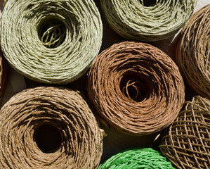 ECO material. Raffia balls close-up. Raffia skeins are ready for knitting.